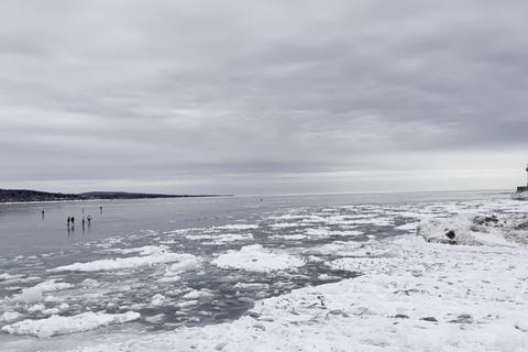 Skaters on the frozen edge of Lake Superior